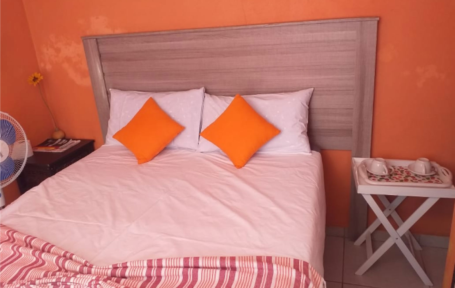 Spacious bedroom with quality bedding